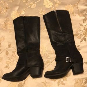 Below the knee black boots with buckle detail